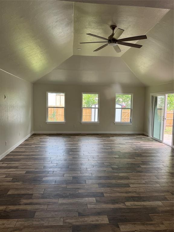 106 Briarwood Crossroads, Moore, OK 73160 - unfurnished room with lofted ceiling, plenty of natural light, dark wood-style floors, a ceiling fan, and a textured ceiling