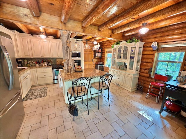 10813 S Peggy Lou Dr, Oklahoma City, OK 73165 - kitchen featuring wooden ceiling with exposed beams, stainless steel appliances, a kitchen breakfast bar, a center island, and log walls