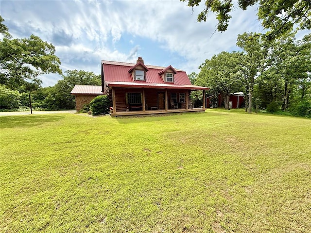 10813 S Peggy Lou Dr, Oklahoma City, OK 73165 - back of house featuring a chimney, a porch, metal roof, and a yard