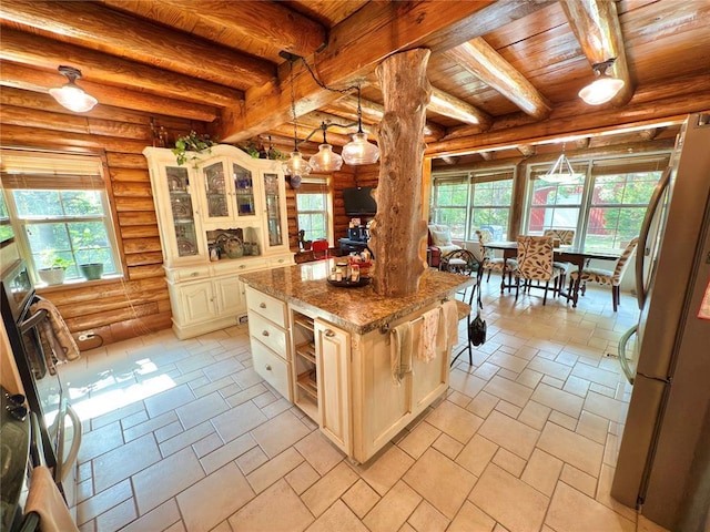 10813 S Peggy Lou Dr, Oklahoma City, OK 73165 - kitchen featuring wood ceiling with exposed beams, freestanding refrigerator, log walls, glass insert cabinets, and cream cabinets