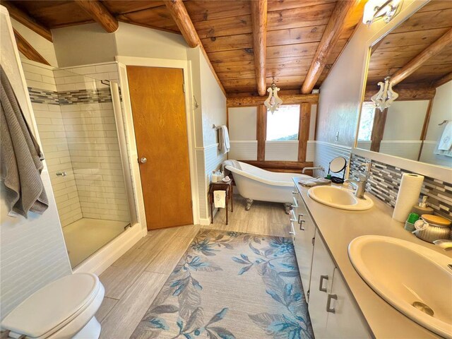 10813 S Peggy Lou Dr, Oklahoma City, OK 73165 - full bath featuring wooden ceiling with exposed beams, wood finished floors, a shower stall, double vanity, and a freestanding tub