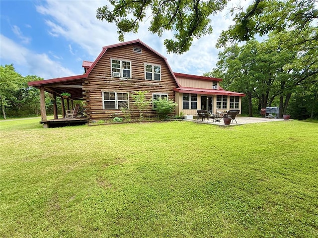 10813 S Peggy Lou Dr, Oklahoma City, OK 73165 - back of house with a gambrel roof, a patio, a lawn, and log exterior