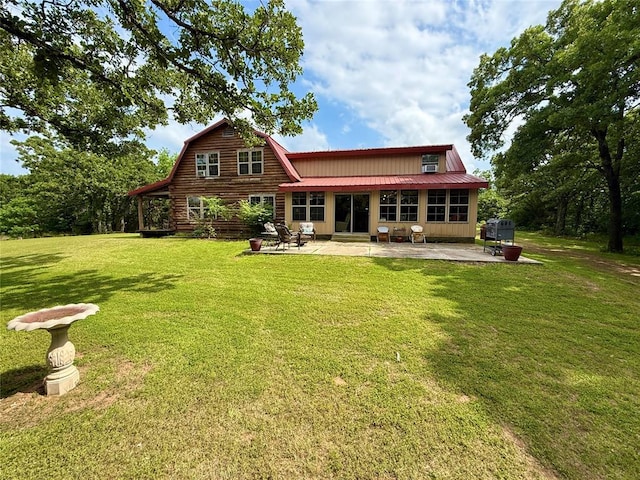 10813 S Peggy Lou Dr, Oklahoma City, OK 73165 - rear view of property featuring a patio, a yard, metal roof, and a gambrel roof