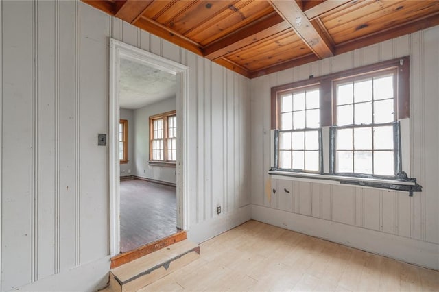 2325 E Madison St, Oklahoma City, OK 73111 - spare room featuring a wood ceiling with exposed beams