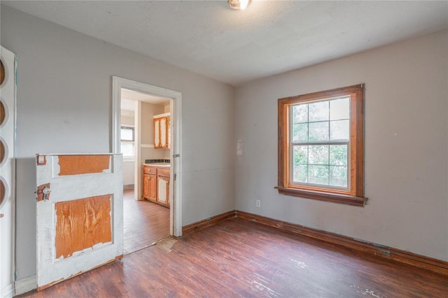 2325 E Madison St, Oklahoma City, OK 73111 - unfurnished room with wood finished floors and baseboards