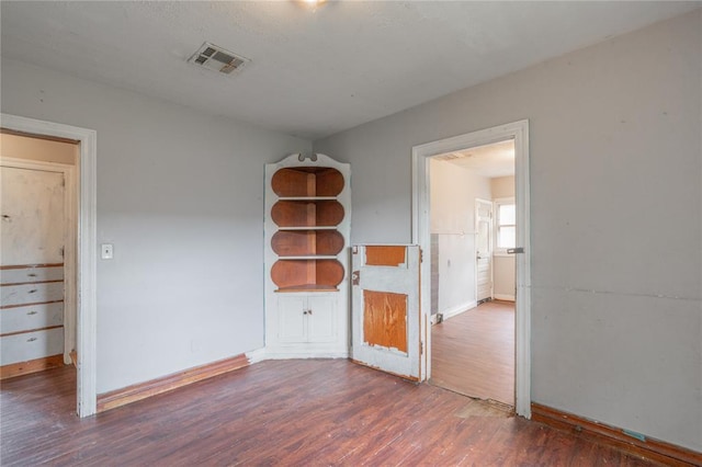 2325 E Madison St, Oklahoma City, OK 73111 - spare room with baseboards and wood finished floors