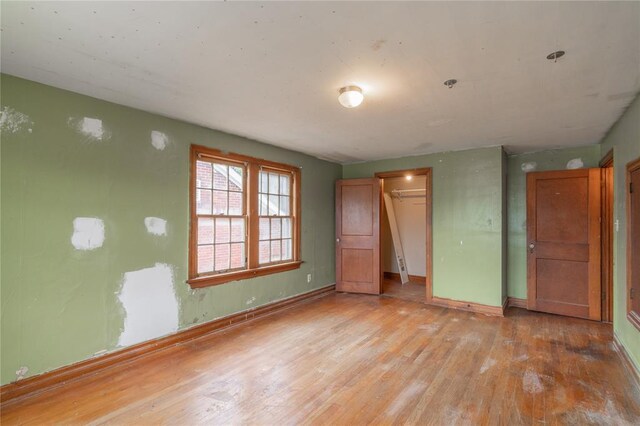 2325 E Madison St, Oklahoma City, OK 73111 - unfurnished bedroom with light wood-style flooring and a closet