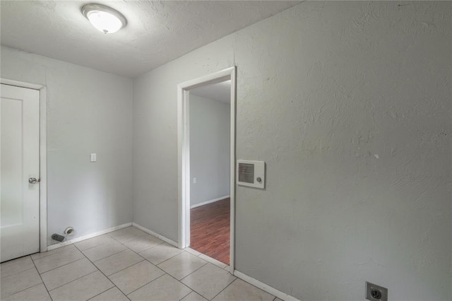 2325 E Madison St, Oklahoma City, OK 73111 - laundry area with electric dryer hookup and light tile patterned floors