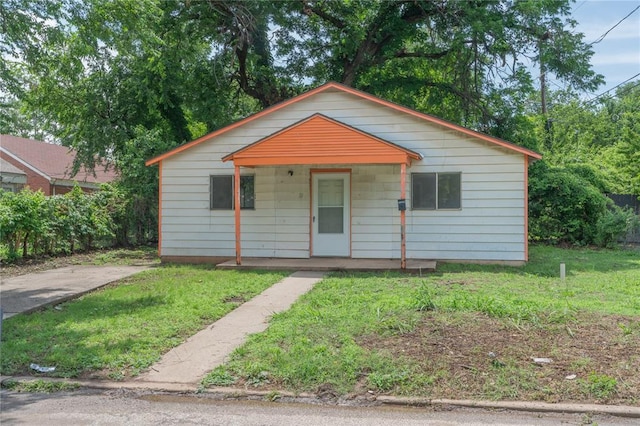 2325 E Madison St, Oklahoma City, OK 73111 - bungalow-style home with a porch and a front yard
