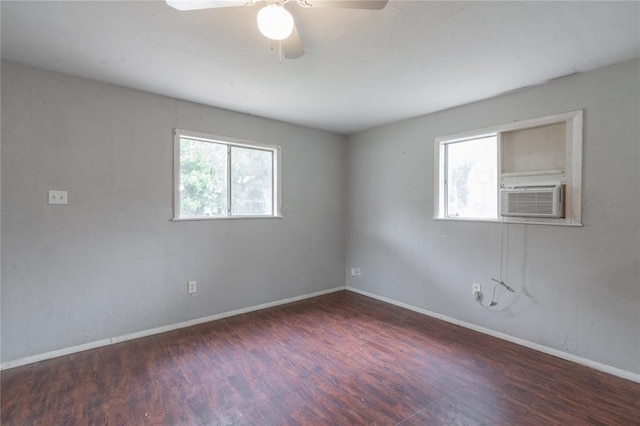 2325 E Madison St, Oklahoma City, OK 73111 - empty room featuring healthy amount of natural light, wood finished floors, cooling unit, and a ceiling fan