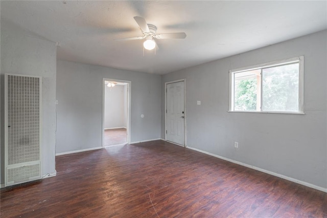 2325 E Madison St, Oklahoma City, OK 73111 - spare room featuring a heating unit, wood finished floors, and a ceiling fan