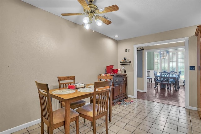 409 Pheasant Cir, Altus, OK 73521 - dining room with light tile patterned floors and a ceiling fan
