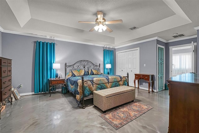 409 Pheasant Cir, Altus, OK 73521 - bedroom with a raised ceiling, crown molding, finished concrete flooring, a ceiling fan, and a closet