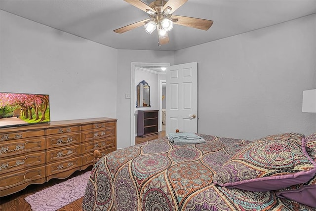 409 Pheasant Cir, Altus, OK 73521 - bedroom featuring wood finished floors and a ceiling fan