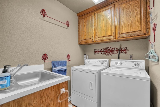 409 Pheasant Cir, Altus, OK 73521 - laundry area with cabinet space, a textured wall, and washer and dryer