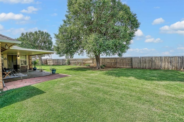409 Pheasant Cir, Altus, OK 73521 - fenced backyard featuring a patio area