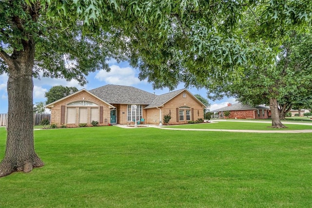 409 Pheasant Cir, Altus, OK 73521 - view of front of property featuring brick siding and a shingled roof