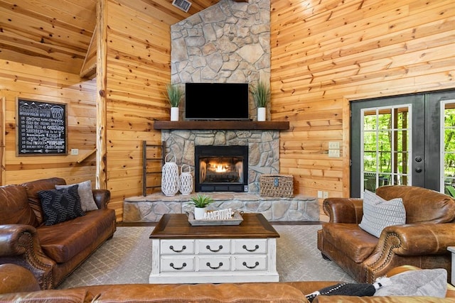 372 Timber Creek Trl, Broken Bow, OK 74728 - living area with wooden walls, vaulted ceiling, a fireplace, and wooden ceiling
