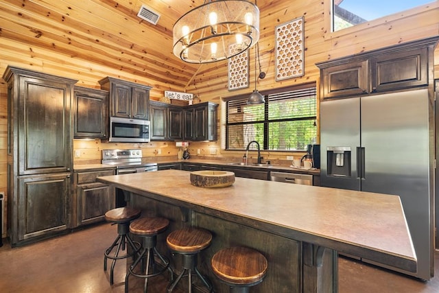 372 Timber Creek Trl, Broken Bow, OK 74728 - kitchen with stainless steel appliances, a sink, finished concrete flooring, dark brown cabinets, and wood ceiling