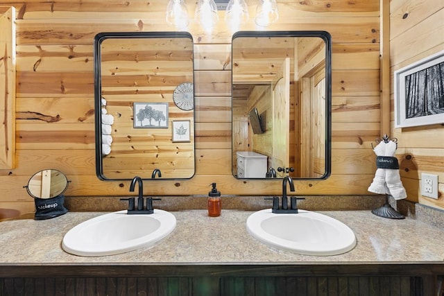 372 Timber Creek Trl, Broken Bow, OK 74728 - bathroom featuring wooden walls and double vanity