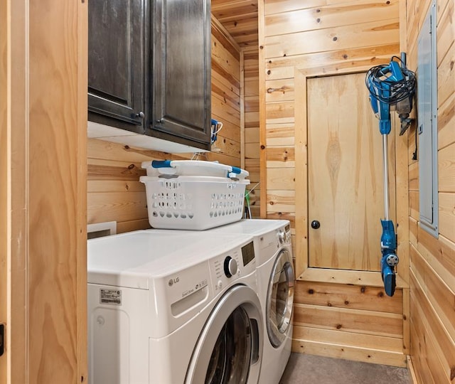 372 Timber Creek Trl, Broken Bow, OK 74728 - laundry room featuring cabinet space, wooden walls, and washer and clothes dryer