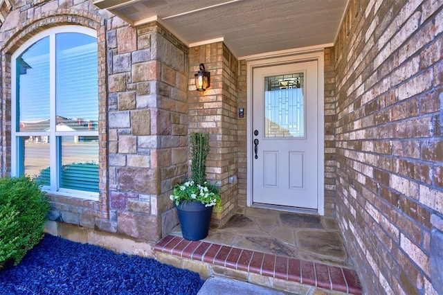 4116 NW 155th St, Edmond, OK 73013 - property entrance featuring brick siding, a porch, and stone siding