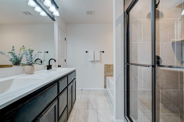 4116 NW 155th St, Edmond, OK 73013 - full bath with double vanity, a bath, a stall shower, and baseboards