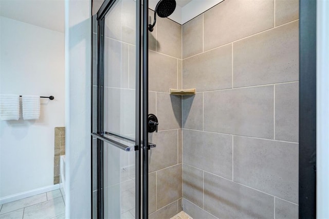 4116 NW 155th St, Edmond, OK 73013 - full bathroom featuring a stall shower and baseboards