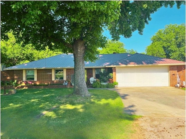 12301 US Highway 77, Lexington, OK 73051 - single story home with an attached garage, brick siding, driveway, and metal roof