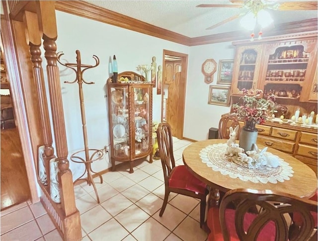 12301 US Highway 77, Lexington, OK 73051 - dining space with a ceiling fan, crown molding, light tile patterned floors, and a textured ceiling