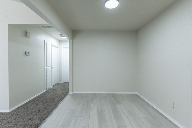 1422 SW 96th St, Oklahoma City, OK 73159 - spare room featuring light wood finished floors and baseboards