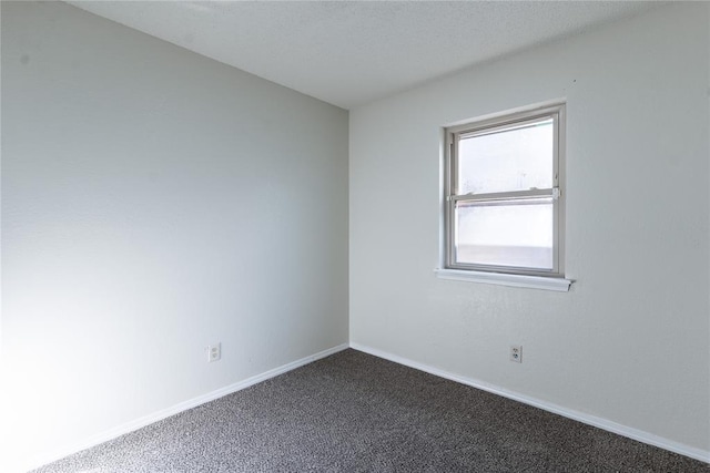1422 SW 96th St, Oklahoma City, OK 73159 - spare room featuring dark carpet and baseboards
