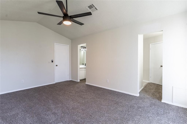 1422 SW 96th St, Oklahoma City, OK 73159 - unfurnished bedroom featuring dark colored carpet, vaulted ceiling, baseboards, ensuite bath, and a ceiling fan