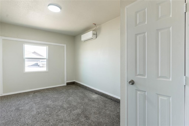 1422 SW 96th St, Oklahoma City, OK 73159 - spare room with an AC wall unit, dark carpet, and baseboards