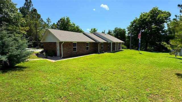 339770 E 1040th Cir, Meeker, OK 74855 - rear view of property with a lawn and brick siding
