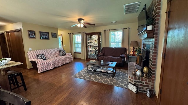 339770 E 1040th Cir, Meeker, OK 74855 - living room featuring ceiling fan, wood finished floors, and a fireplace