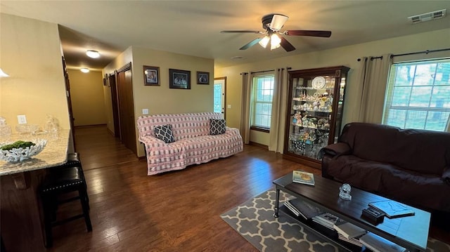 339770 E 1040th Cir, Meeker, OK 74855 - living area with plenty of natural light, dark wood-style flooring, ceiling fan, and baseboards