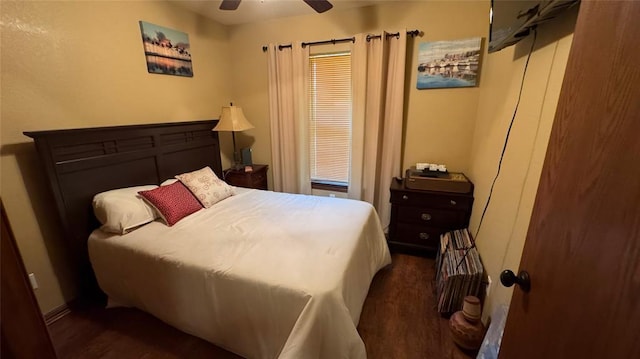 339770 E 1040th Cir, Meeker, OK 74855 - bedroom featuring dark wood-style floors, a ceiling fan, and baseboards