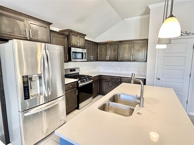 9632 Ashford Dr, Yukon, OK 73099 - kitchen featuring appliances with stainless steel finishes, vaulted ceiling, dark brown cabinets, tasteful backsplash, and crown molding