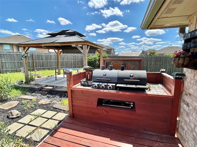 9632 Ashford Dr, Yukon, OK 73099 - deck featuring a fenced backyard, a gazebo, and a grill