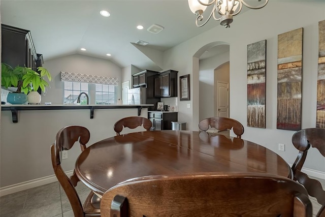 19005 Valencia Park Dr, Edmond, OK 73012 - dining area featuring vaulted ceiling, arched walkways, a chandelier, recessed lighting, and baseboards