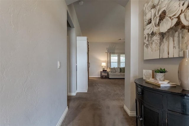 19005 Valencia Park Dr, Edmond, OK 73012 - corridor featuring baseboards and dark colored carpet