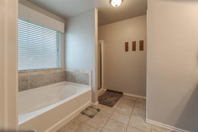 19005 Valencia Park Dr, Edmond, OK 73012 - full bath with a bath, tile patterned flooring, a stall shower, and baseboards