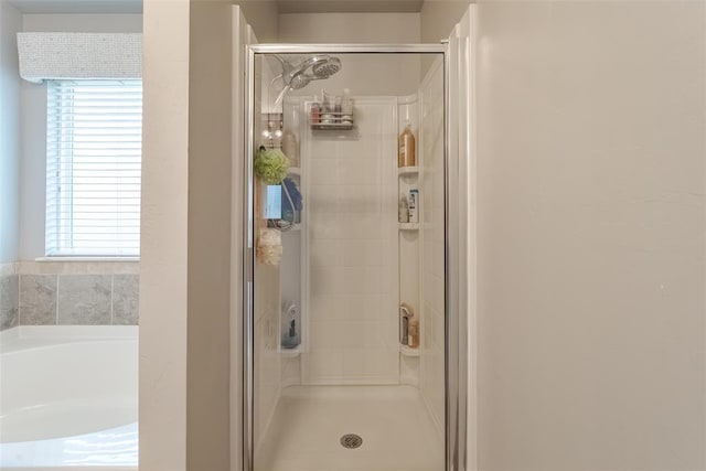 19005 Valencia Park Dr, Edmond, OK 73012 - full bath with a shower stall, plenty of natural light, and a garden tub