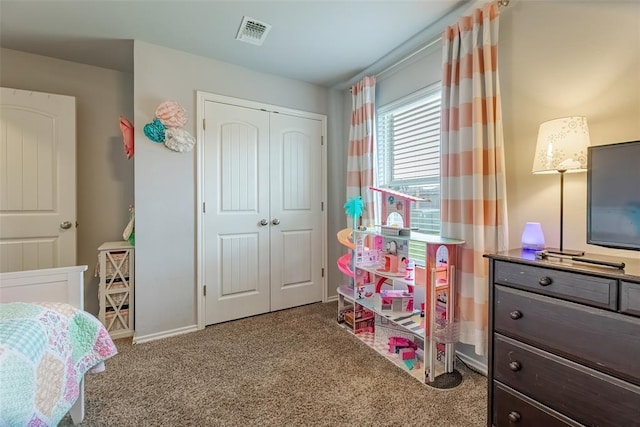 19005 Valencia Park Dr, Edmond, OK 73012 - bedroom featuring carpet floors, a closet, and baseboards