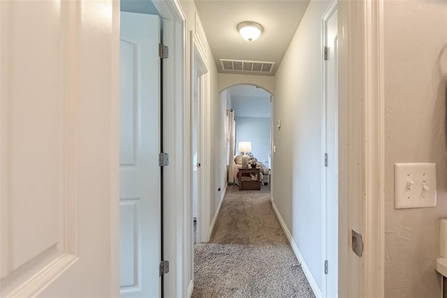 19005 Valencia Park Dr, Edmond, OK 73012 - hallway with arched walkways and light colored carpet