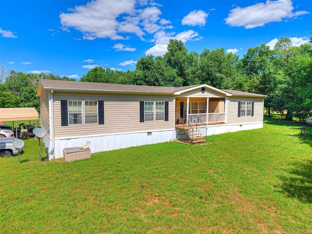 19519 N 2730th Rd, Kingfisher, OK 73750 - manufactured / mobile home with a porch, a front yard, and a detached carport