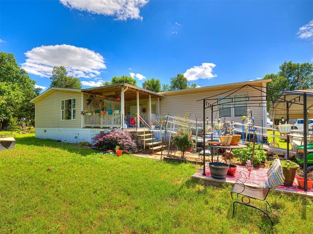 19519 N 2730th Rd, Kingfisher, OK 73750 - rear view of property with covered porch and a lawn