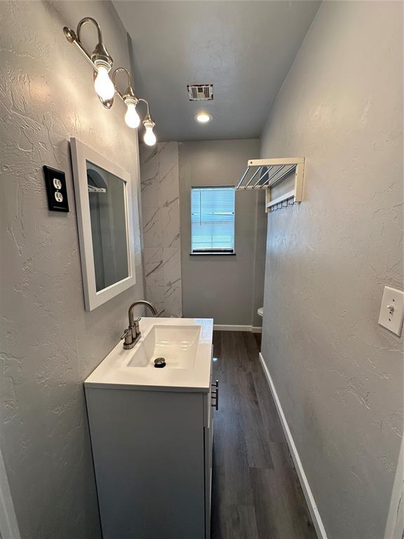 327 SW Grand Blvd, Oklahoma City, OK 73109 - bathroom with vanity and wood finished floors