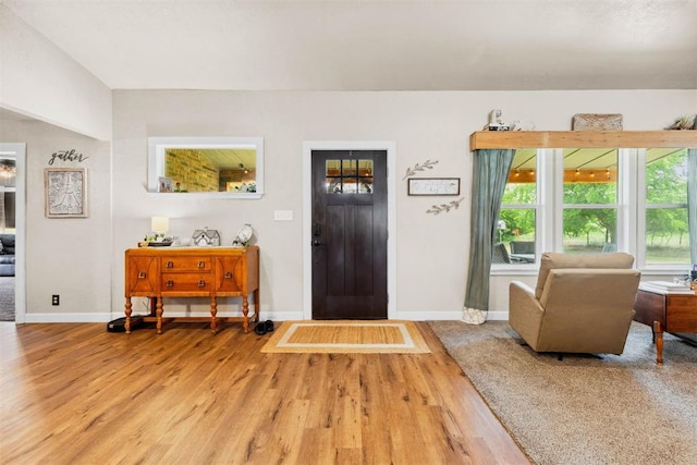 26114 State Highway 19, Cyril, OK 73029 - entryway with baseboards and wood finished floors
